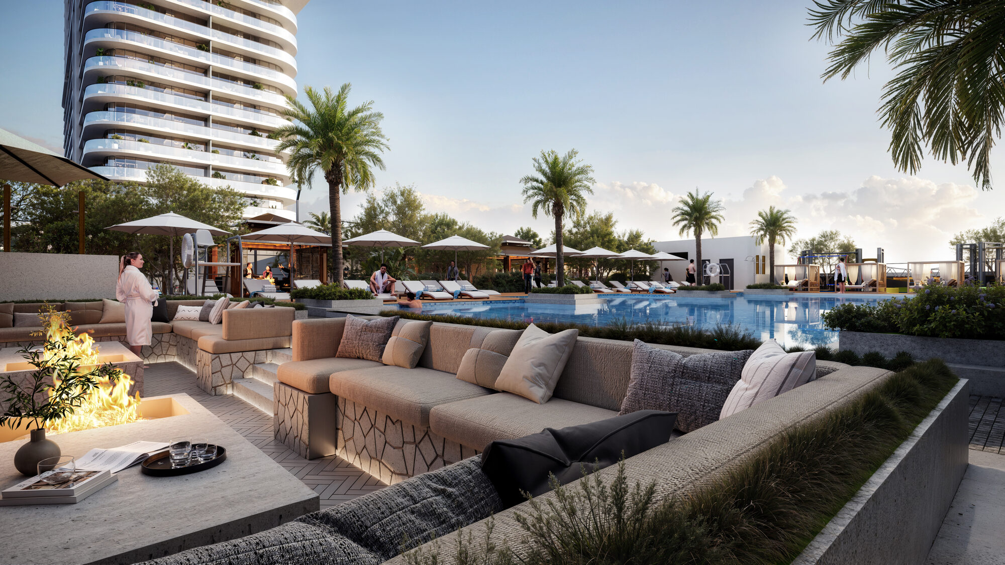 Espace lounge autour de la piscine ONE PENINSULA Batumi by HOLM Developments — outdoor pool lounge terrace with palm trees and sun beds at the foot of the residences